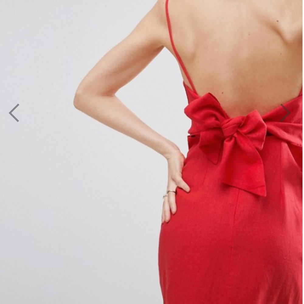 NWOT red dress with bow. Runs small in hip area.